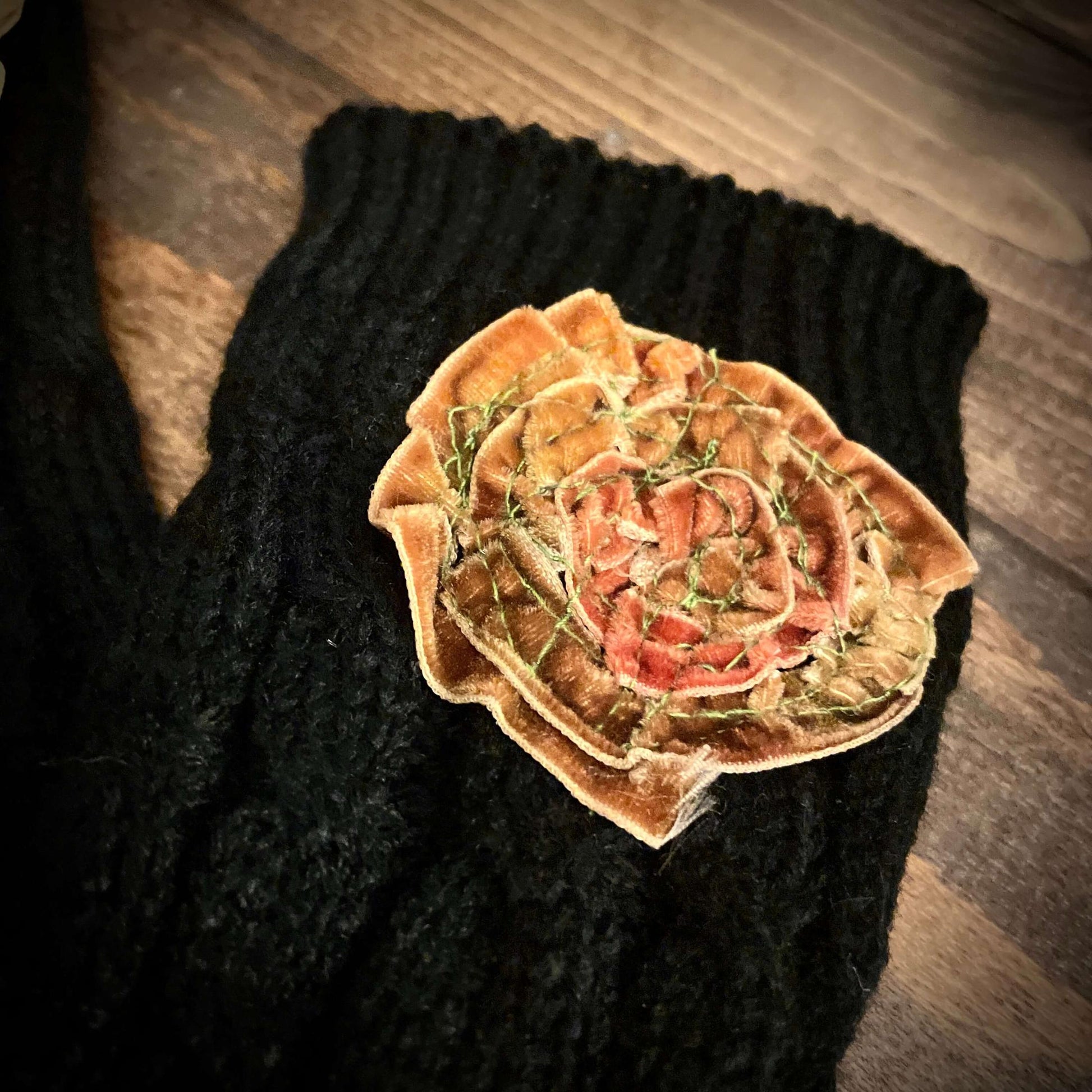 Decorative flower on a black textured surface