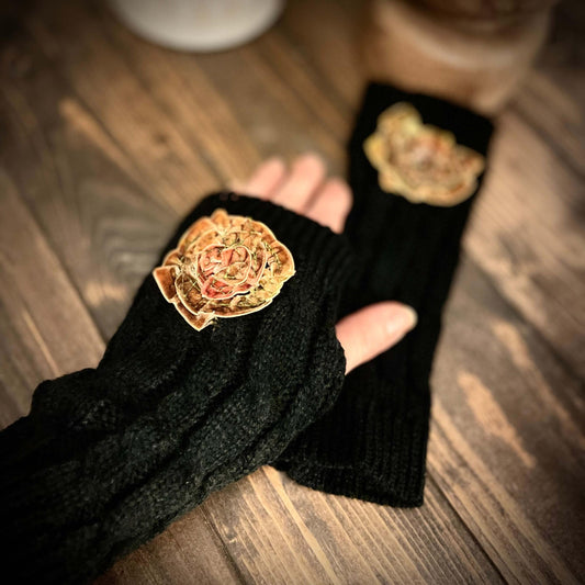 finger-less gloves on wood surface