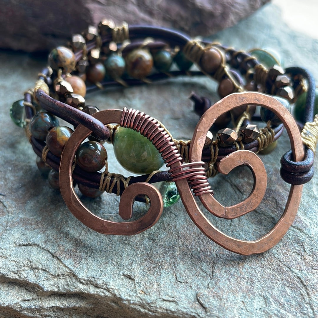 Close up of Triple Wrap Beaded Bracelet with Swirl closure