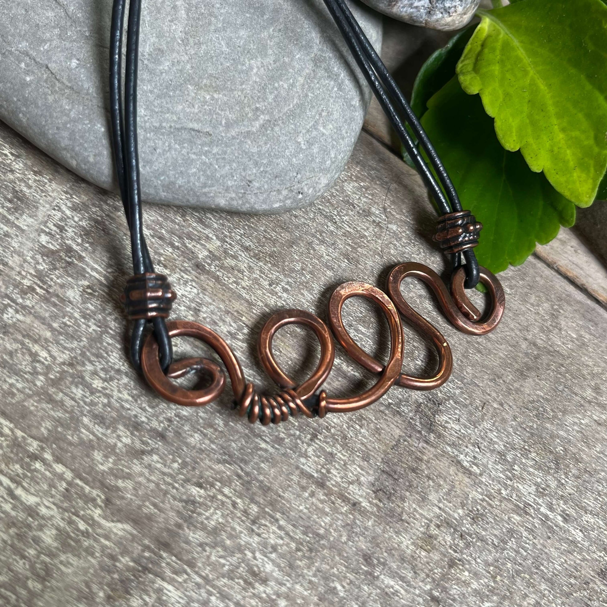 close up of copper swirl necklace