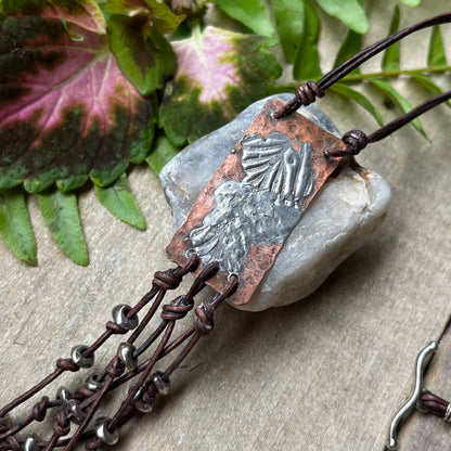 Close up of Copper & Silver Pendant with Leather Fringe