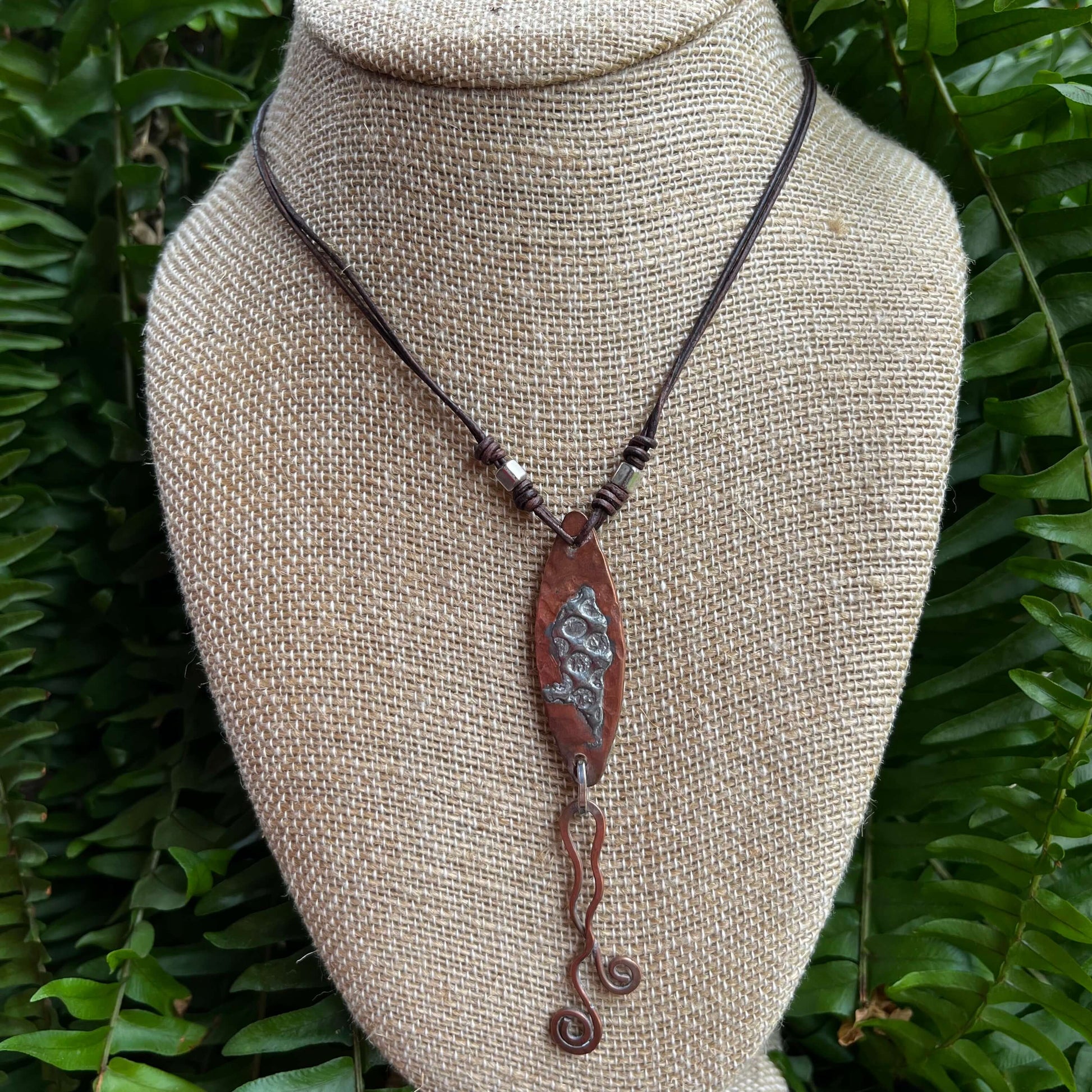 Mixed Metal Copper Silver Pendant hanging on bust