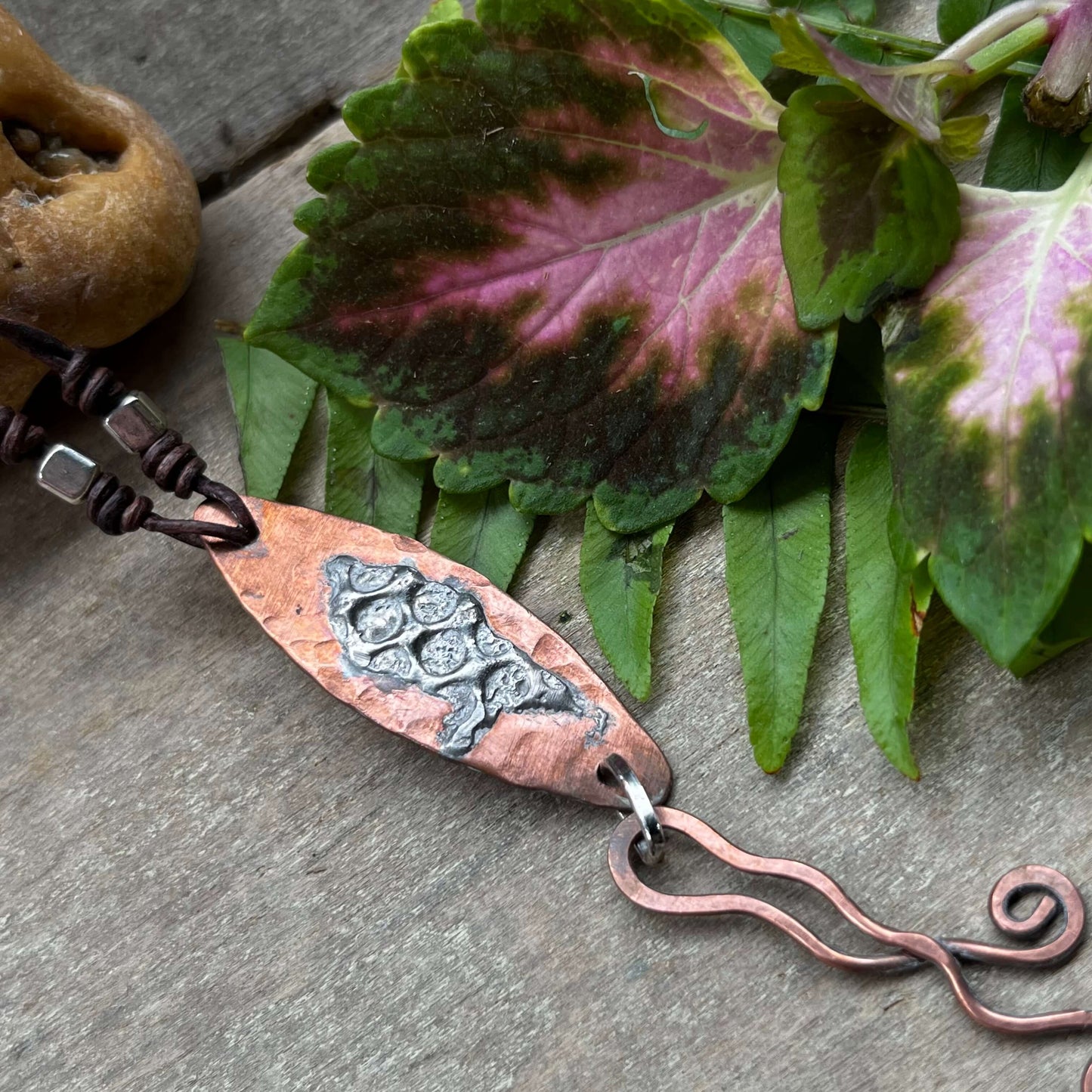 Close up of Mixed Metal Copper Silver Pendant with leaf