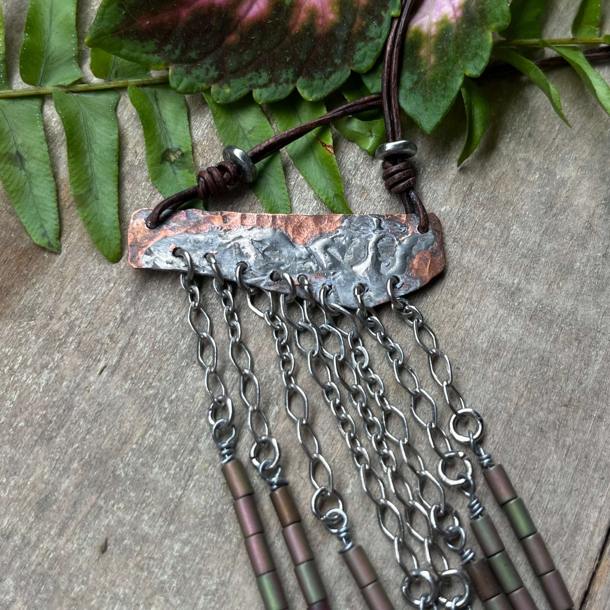 close up of pendant with leaves