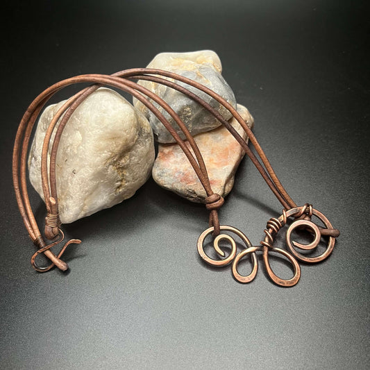 Copper Swirl Necklace on black background