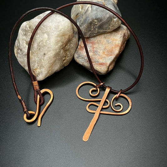 copper swirl necklace with moving pieces