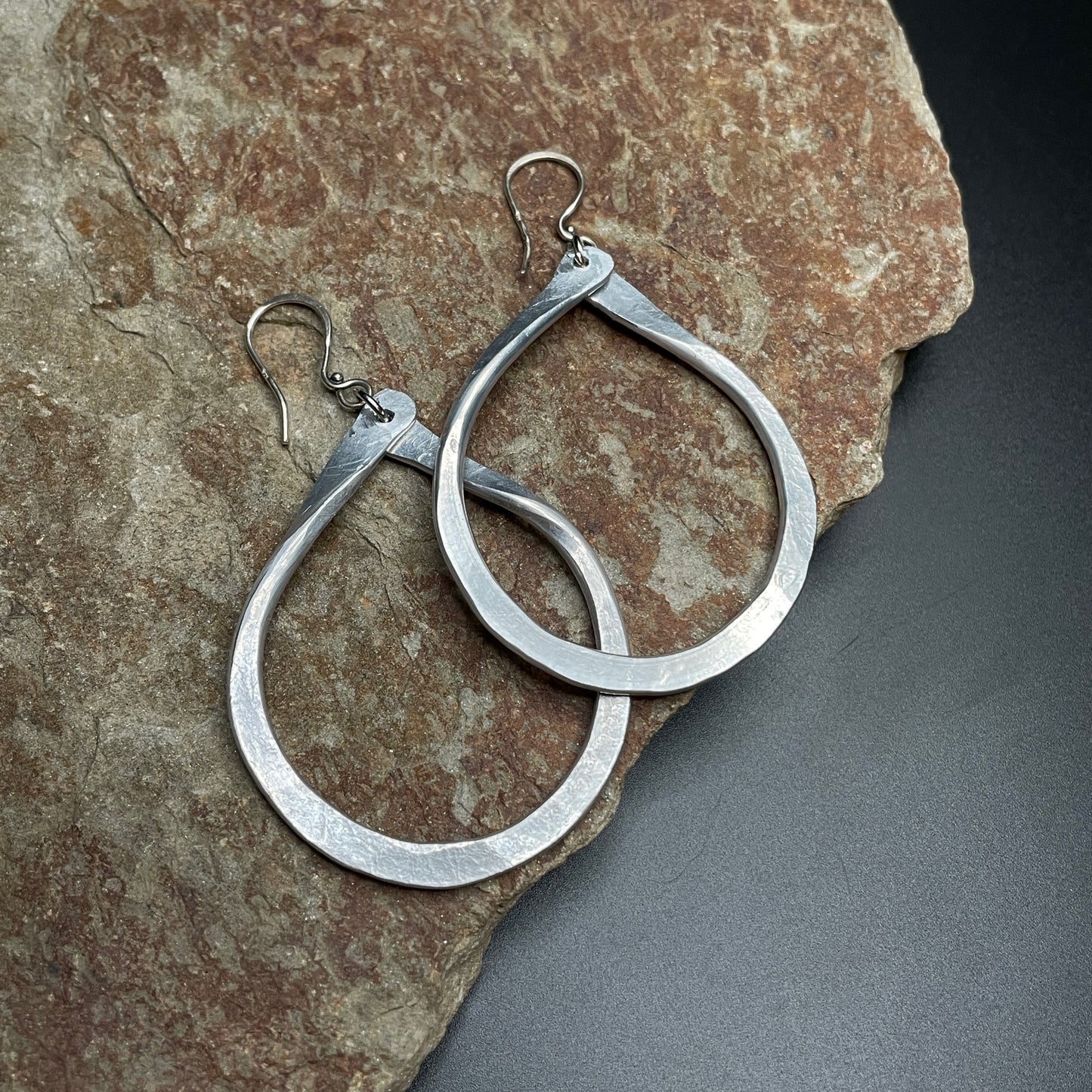 Classic Lightweight Aluminum Loop Earrings on rock