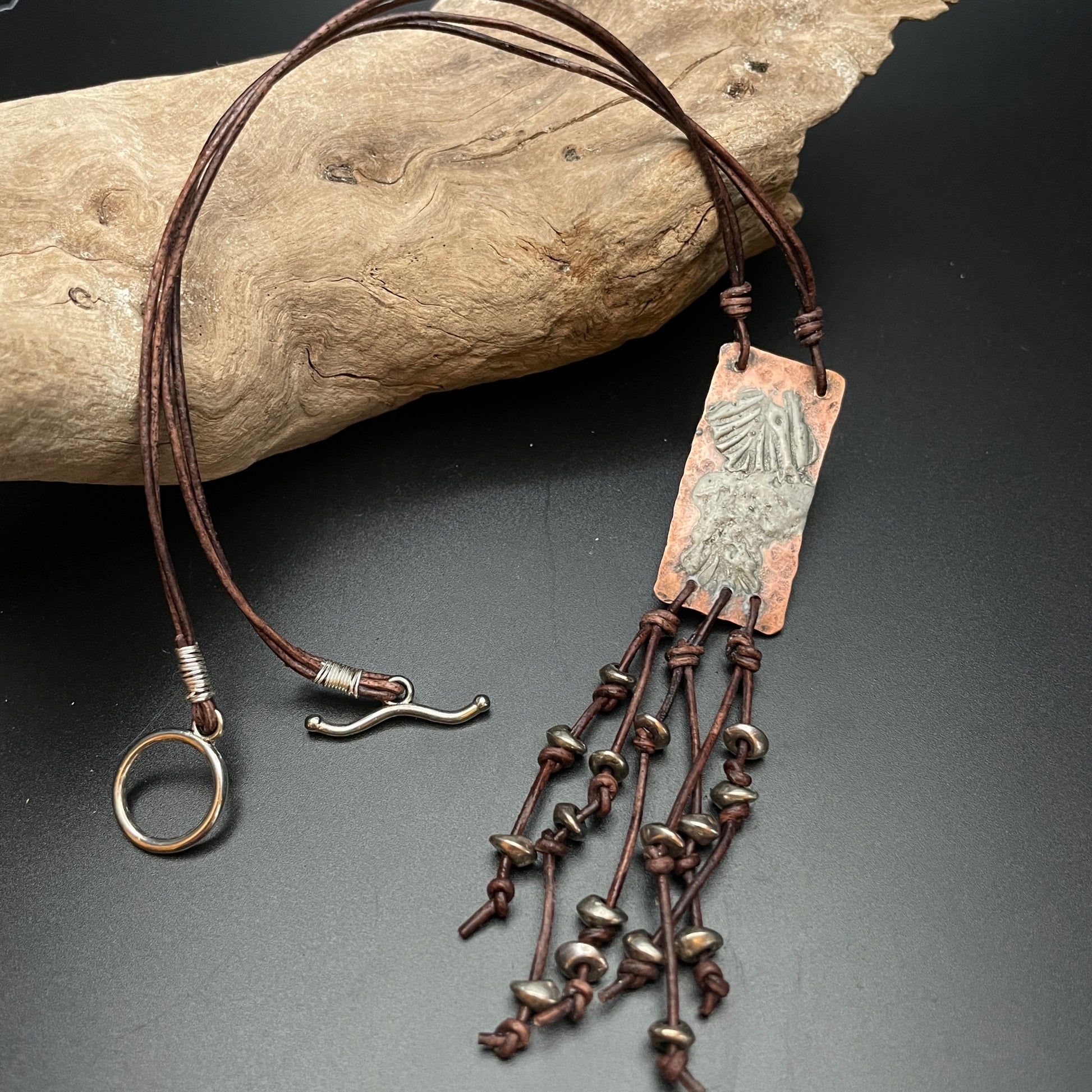 Copper & Silver Pendant with Leather Fringe on drift wood