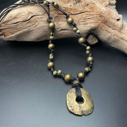 Brass Medallion Necklace on drift wood