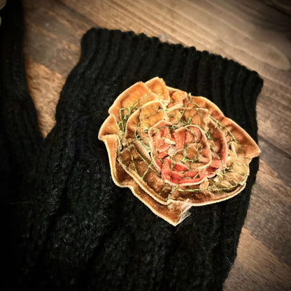 Decorative flower on a black textured surface