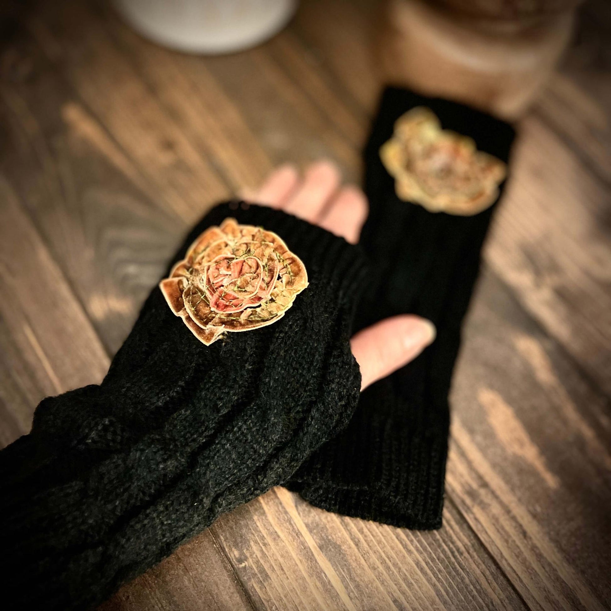 finger-less gloves on wood surface